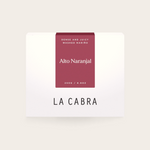 Coffee Community Columbia Alto Naranjal coffee bag with a deep red label featuring washed Nariño coffee details.