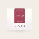 Coffee Community Columbia Alto Naranjal coffee bag with a deep red label featuring washed Nariño coffee details.