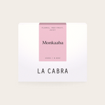 Coffee Community Columbia Monkaaba Pink Bourbon coffee bag with a minimalist white and pink label