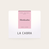 Coffee Community Columbia Monkaaba Pink Bourbon coffee bag with a minimalist white and pink label